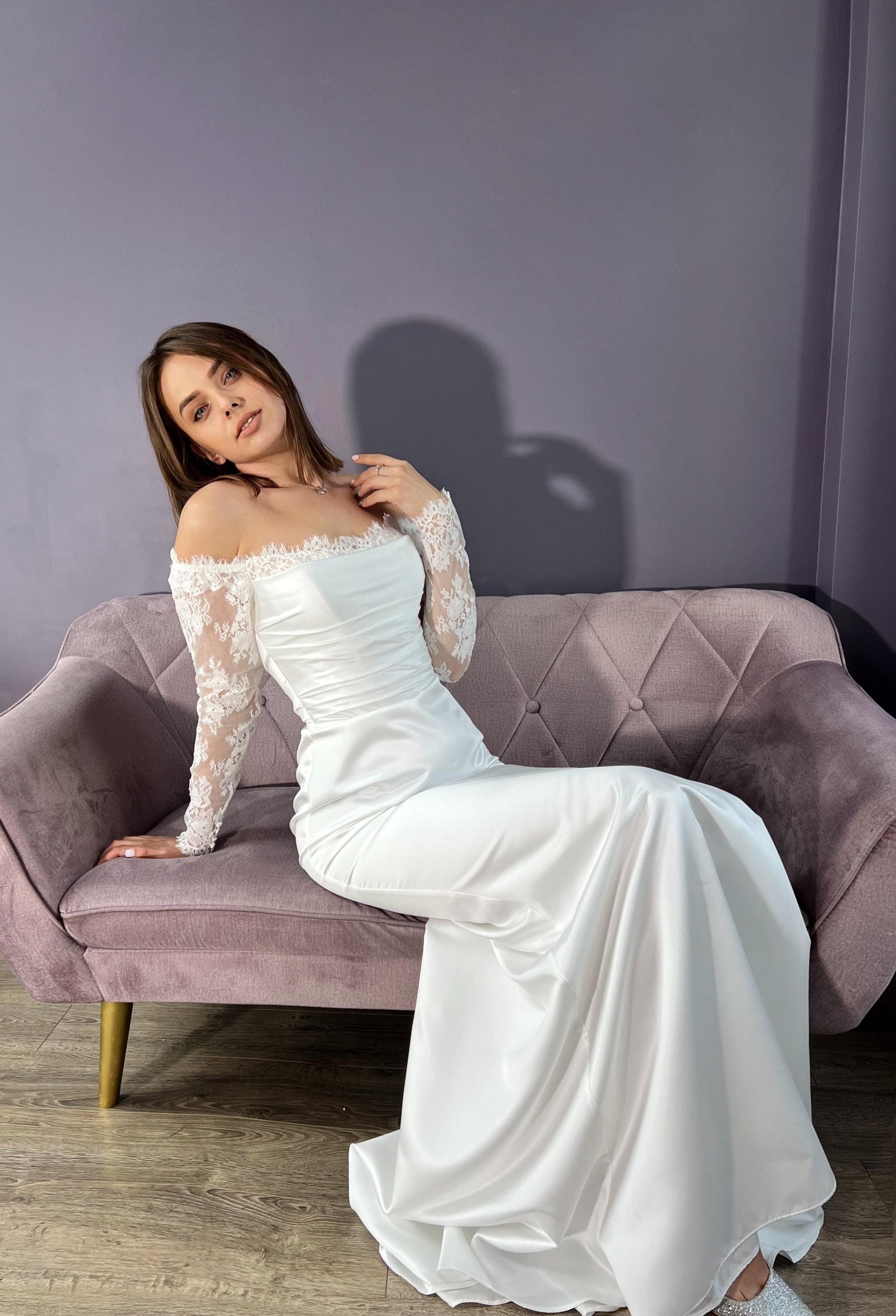 Elegant satin Off-Shoulder Lace Sleeve Bridal Gown with Classic Corset & Train. Open low back wedding delicate dress