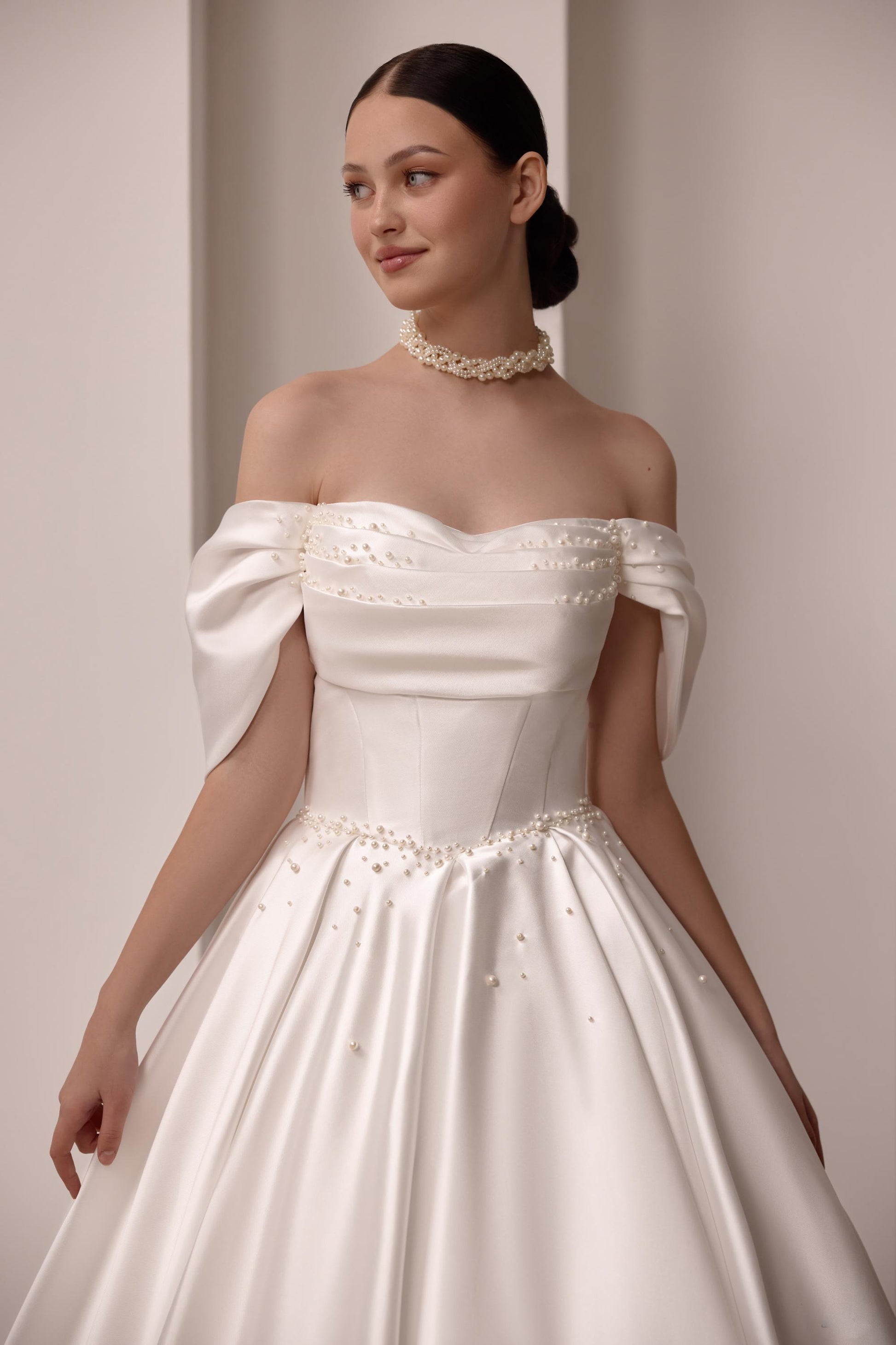 Luxurious Satin Off-Shoulder Wedding Gown with Corset Top, Pearls Detailing, and Elegant Train | Princess & Fairy Style Bridal Dress