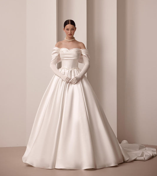 Luxurious Satin Off-Shoulder Wedding Gown with Corset Top, Pearls Detailing, and Elegant Train | Princess & Fairy Style Bridal Dress