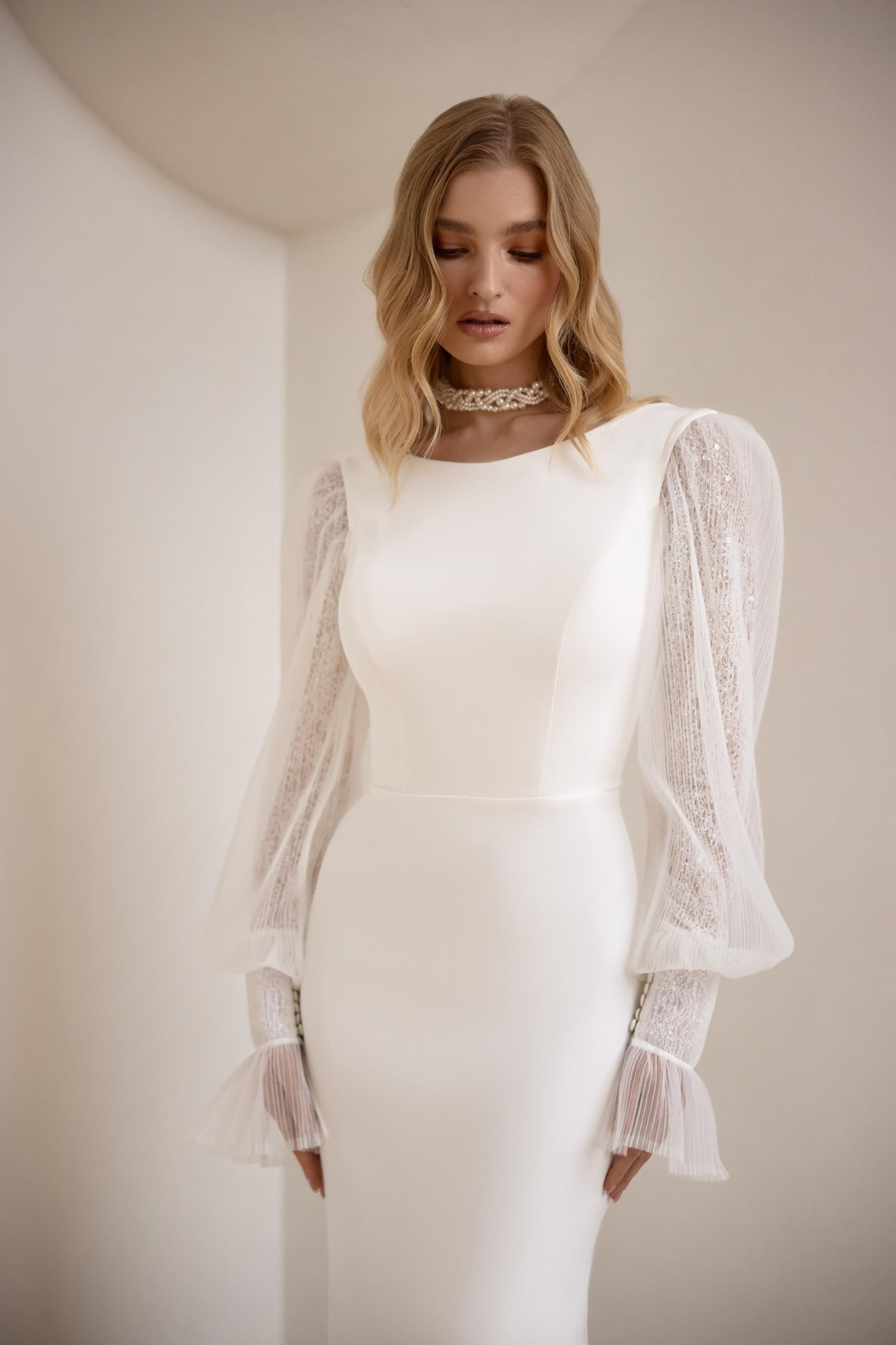 Elegant Long Sleeve Crepe Wedding Gown with High Neckline, Mermaid Silhouette and Extended Train - Classic and Modern Bridal Dress