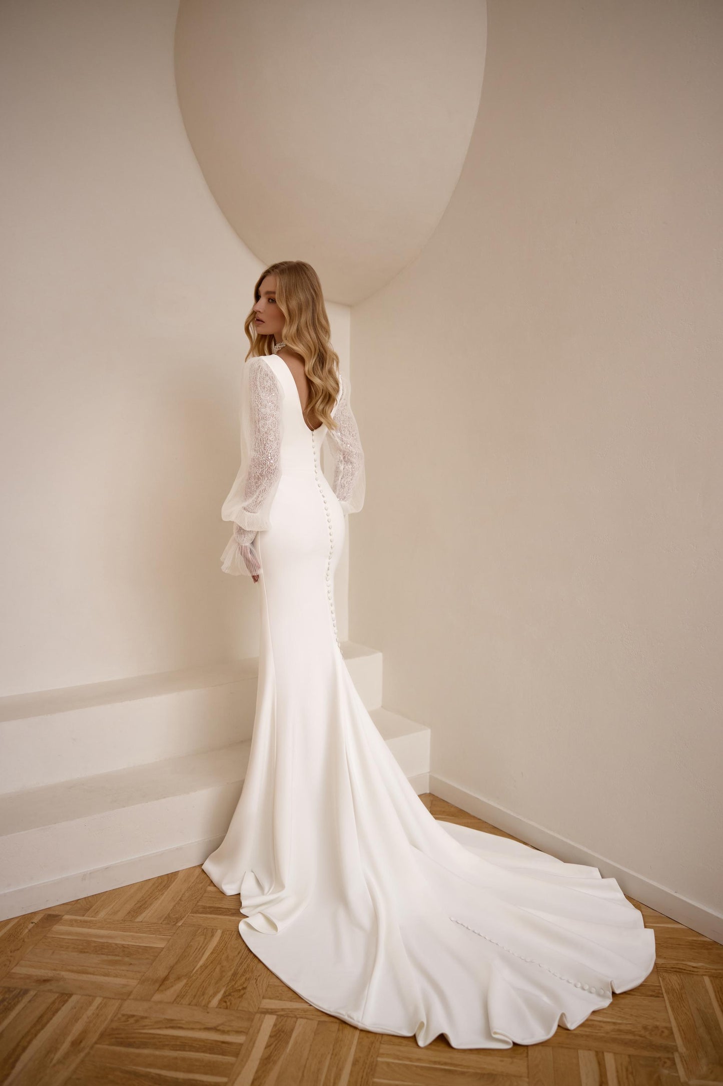 Elegant Long Sleeve Crepe Wedding Gown with High Neckline, Mermaid Silhouette and Extended Train - Classic and Modern Bridal Dress