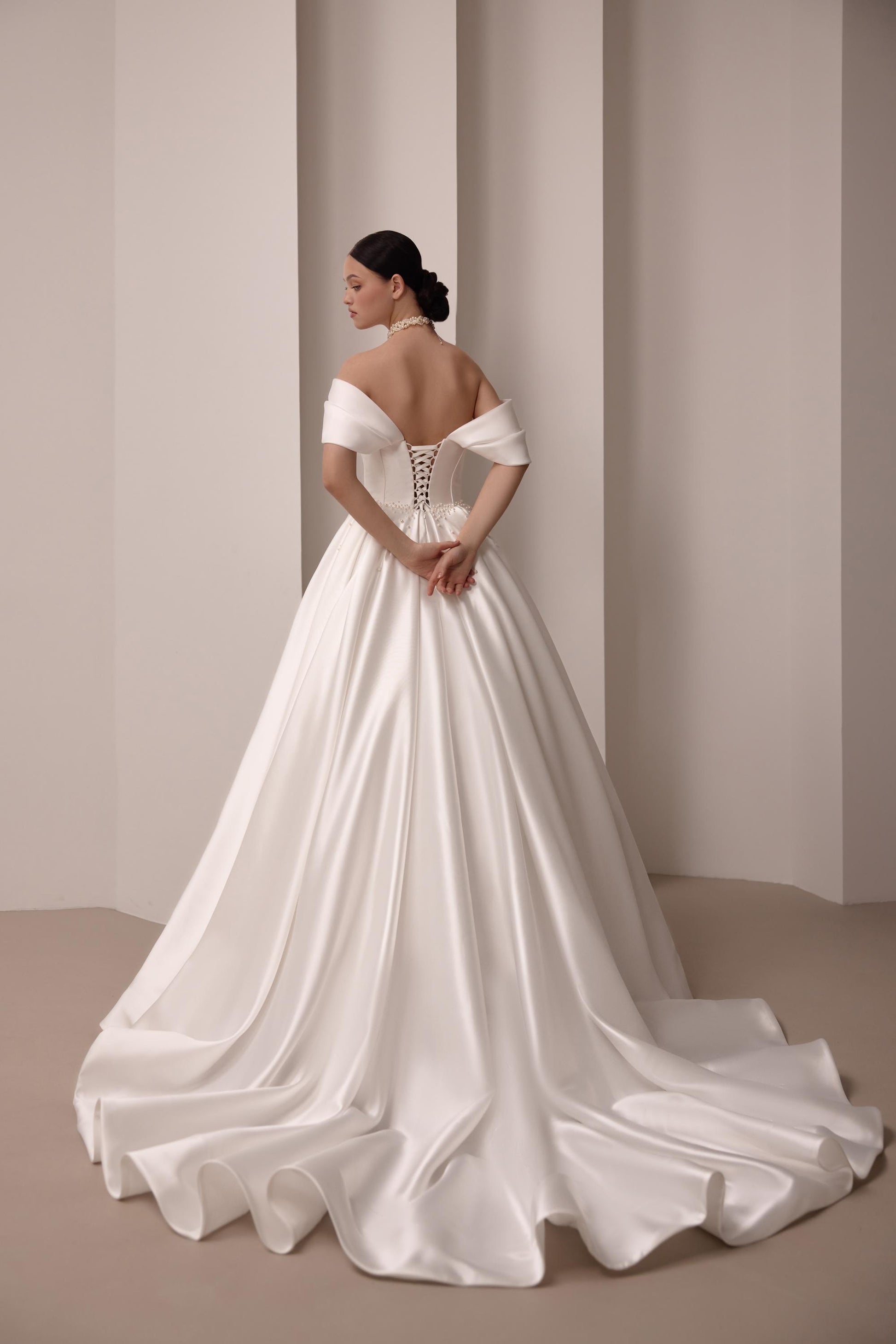 Luxurious Satin Off-Shoulder Wedding Gown with Corset Top, Pearls Detailing, and Elegant Train | Princess & Fairy Style Bridal Dress