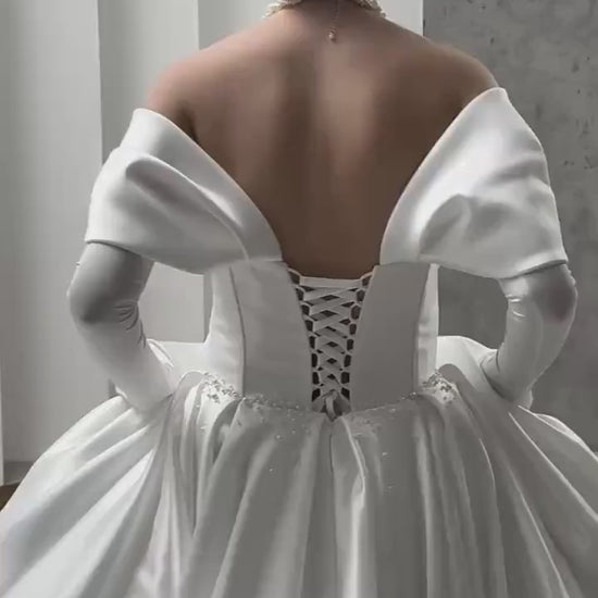 Luxurious Satin Off-Shoulder Wedding Gown with Corset Top, Pearls Detailing, and Elegant Train | Princess & Fairy Style Bridal Dress
