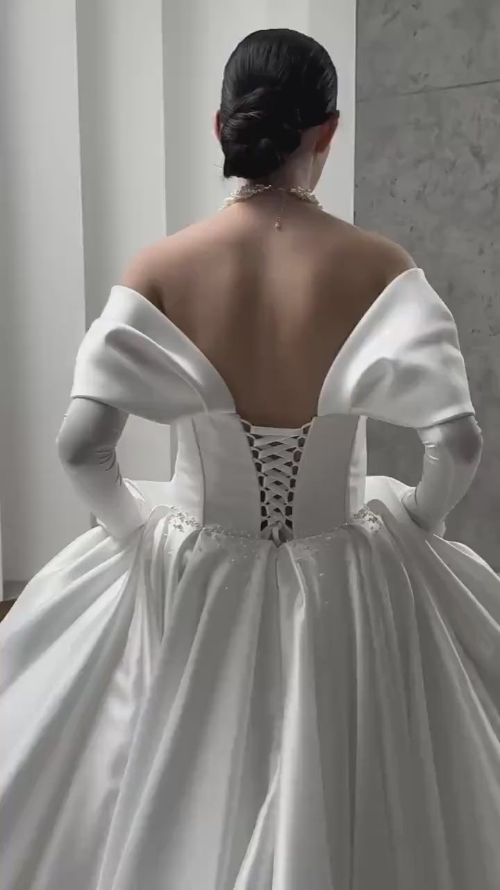 Luxurious Satin Off-Shoulder Wedding Gown with Corset Top, Pearls Detailing, and Elegant Train | Princess & Fairy Style Bridal Dress